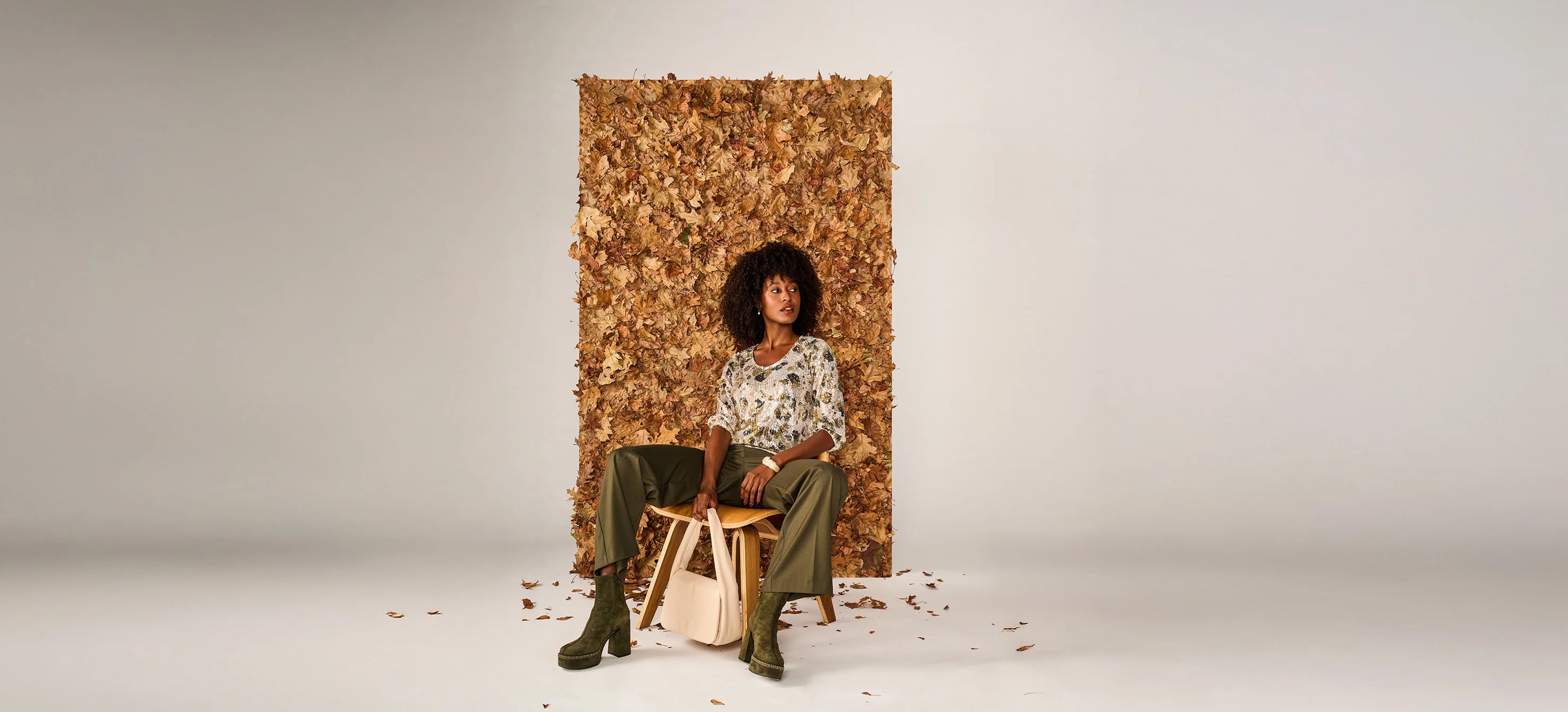 Model with a khaki pants and khaki with ecru inspired blouse. Green ICE Outfit